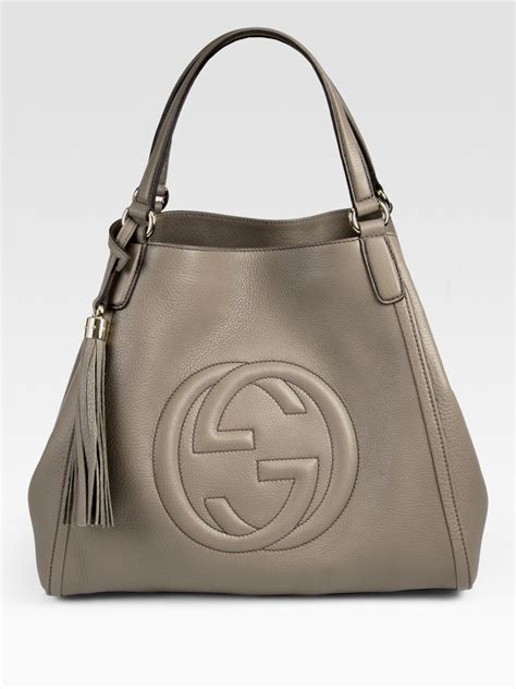 gucci dark grey shoulder handbag.